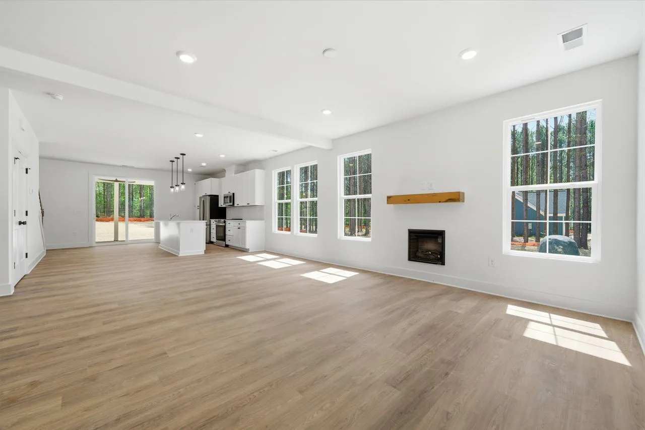 Open-concept great room with 9-foot ceilings and electric fireplace — 1424 Quiver Way, York SC