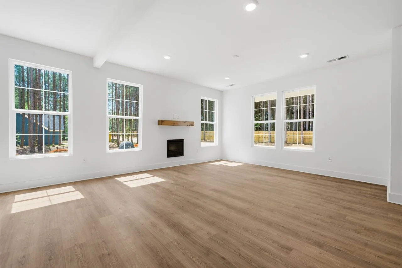 Great room with LVP flooring and electric fireplace — 1424 Quiver Way, York SC
