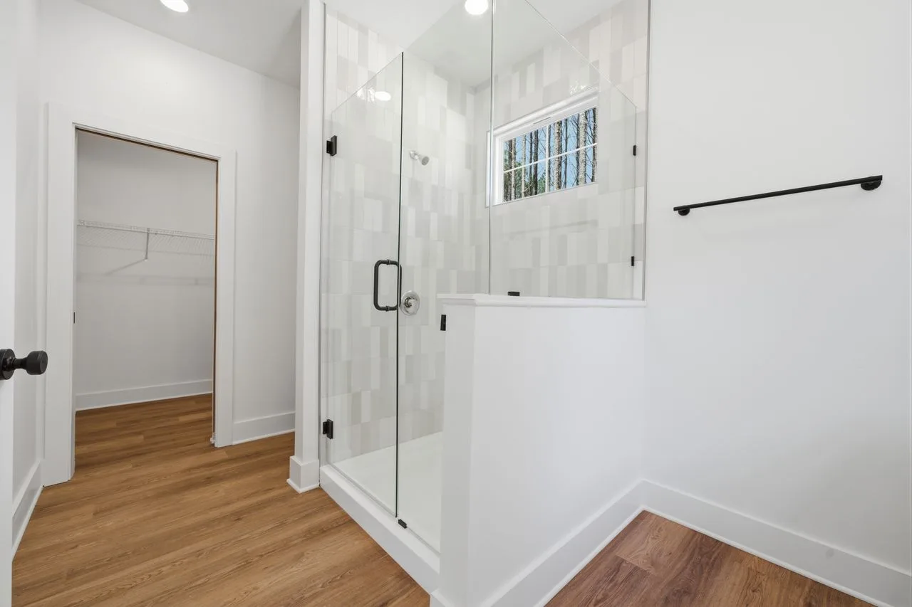 Owner's bath with glass tile shower and dual vanities — 1424 Quiver Way, York SC