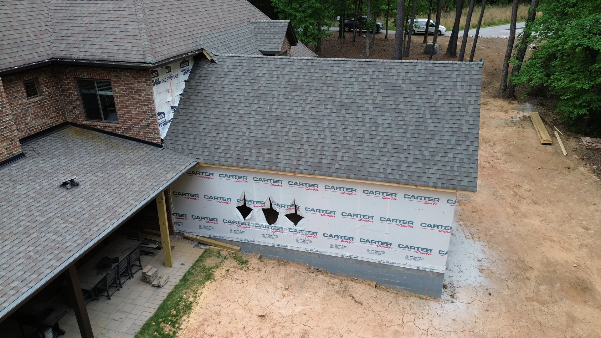 Aerial view of brick addition rear elevation and roofline — York County SC