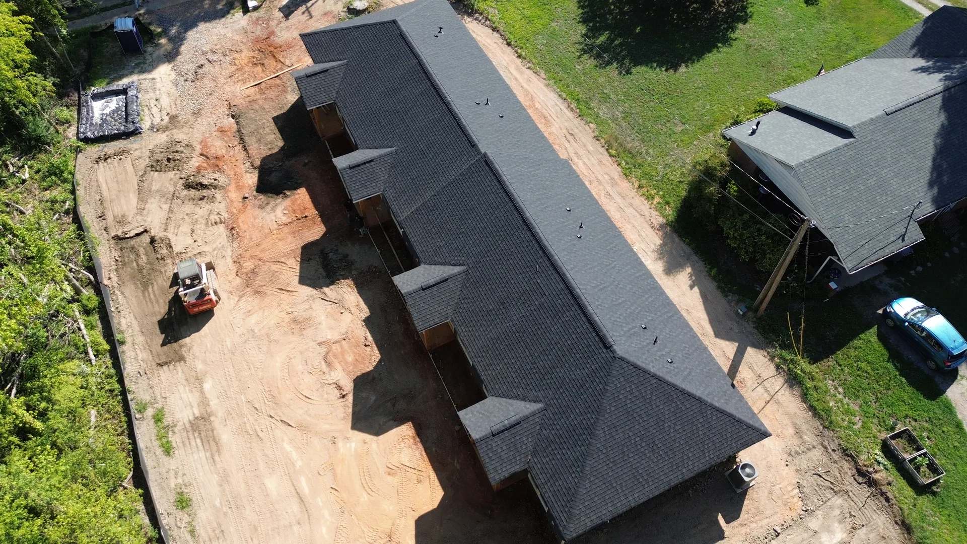 Aerial roof and site overview of 3,200 SF quadplex with off-street parking — Clover SC
