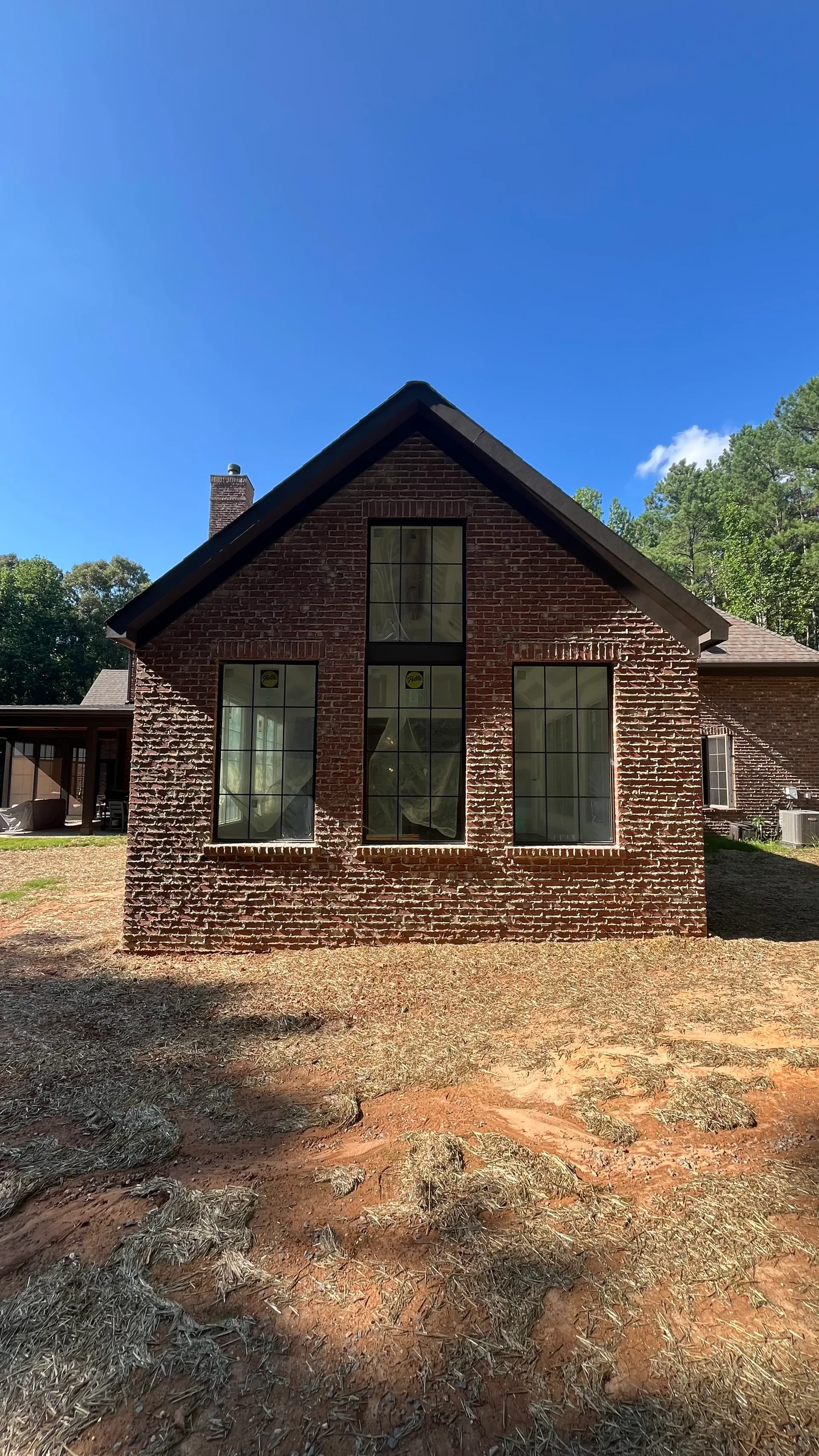 Front gable and Pella windows on new brick great room addition — York County SC home expansion