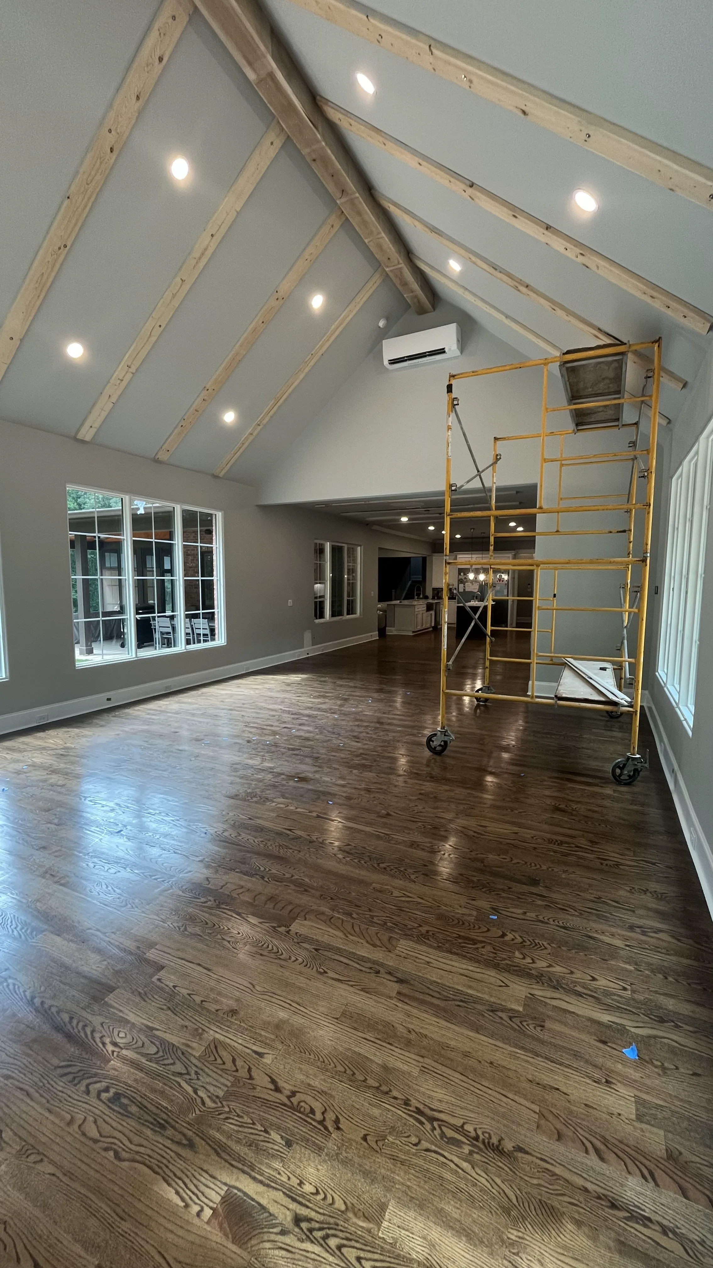 Vaulted great room ceiling with exposed wood beams and recessed lighting — 645 SF addition, York County SC