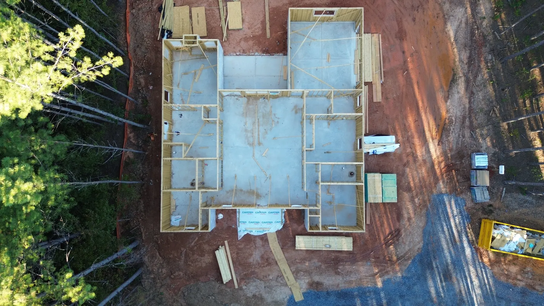 Overhead drone view of the Contemporary Ranch floor plan taking shape during wall framing in York County, SC