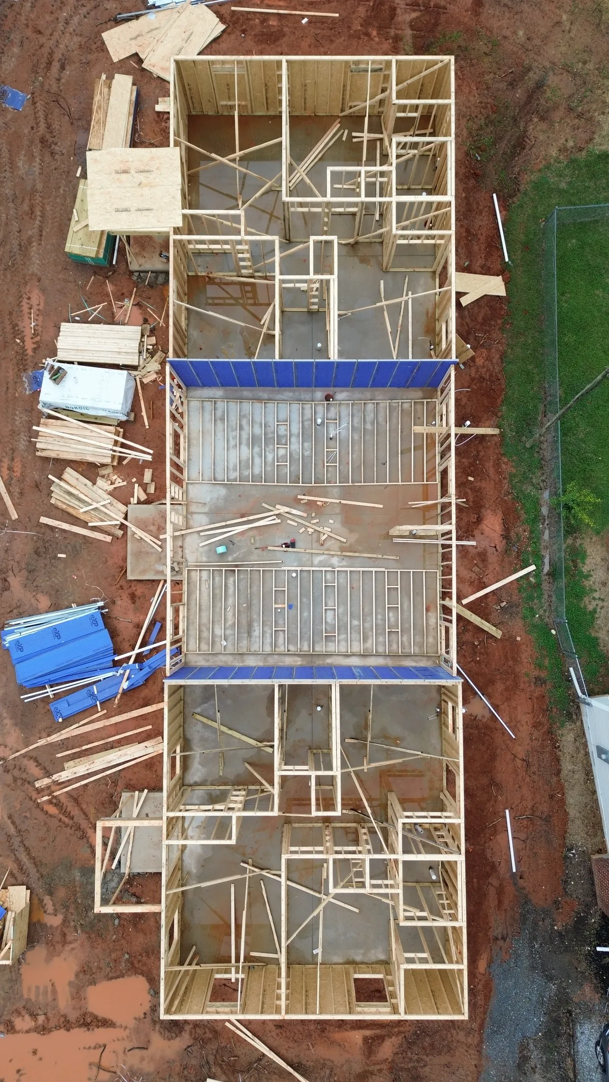 Top-down drone view of the Clover, SC triplex showing walls and rooms taking shape